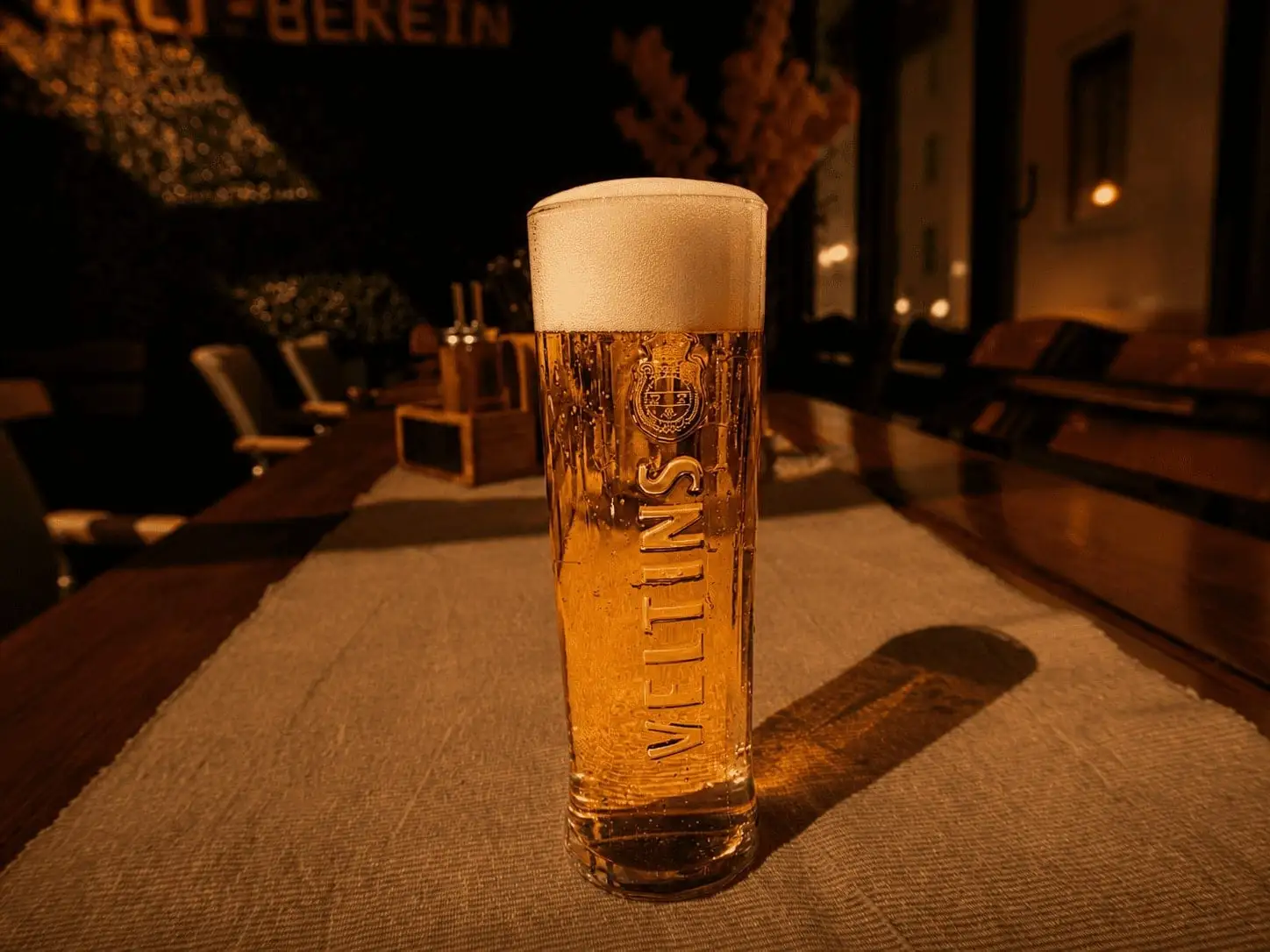 Veltins Pilsener in warm pub atmosphere